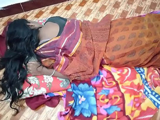 An Indian woman joins her husband and his friend in bed while he is asleep