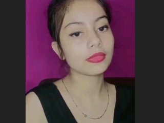 A stunning lady seductively displays her large breasts