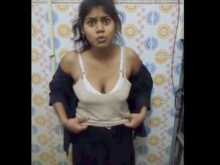 Indian woman undressing in restroom