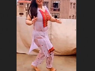 A seductive woman performs a rain dance and displays her underwear