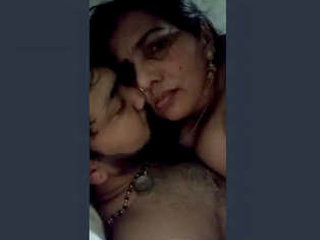 A seductive Indian wife passionately kisses and engages in sexual intercourse with her husband's penis