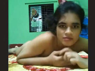 A South Asian woman from Dhaka undressing