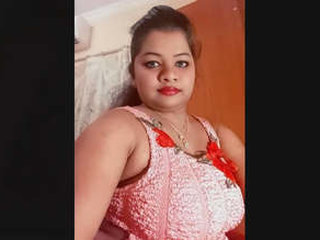 South Asian mature woman with large breasts displays and stimulates her moist vagina