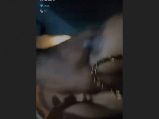 Jaya, the wife, reveals her breasts in a sensual display