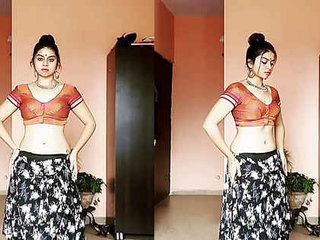 A seductive Indian beauty performs an enticing dance routine