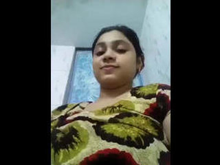 Beautiful and adorable girl with large breasts posing nude