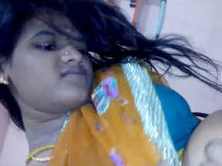 Indian housewife in traditional saree video recording
