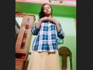 A pretty young Indian woman strips down and reveals her nude body for money