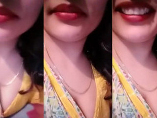 Sensual display of breasts during video conversation