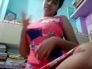 Indian teenage girl reveals her alluring figure as she unzips her dress