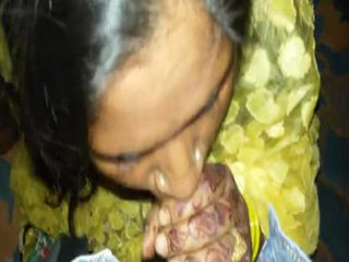 Indian woman in yellow saree gives oral pleasure to a well-endowed man