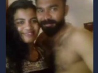 Desi couple shares passionate moments in a bedroom