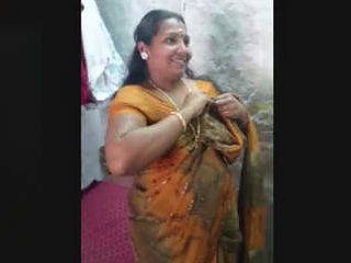 Aunty from the south undresses in a sari