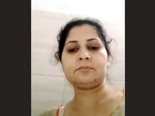 Indian bhabhi pleasures herself with her fingers in a seductive video