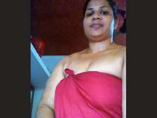Watch a busty Malayalam bhabhi in action