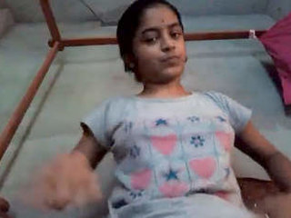 Teen Indian schoolgirl pleasures herself with audio in solo video
