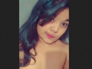 Cute teen girl flaunts her nude body in front of the camera