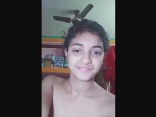 Young girl pleasures herself with her fingers and toys