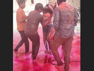 Three guys press on Indian girl's boobs during Holi celebration