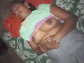 Husband pleasures his wife's breasts in a gentle and intimate encounter