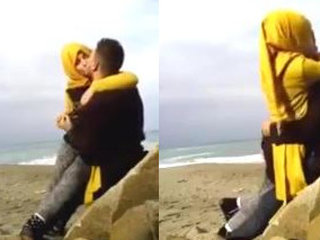 Hijab-clad women indulge in passionate kissing